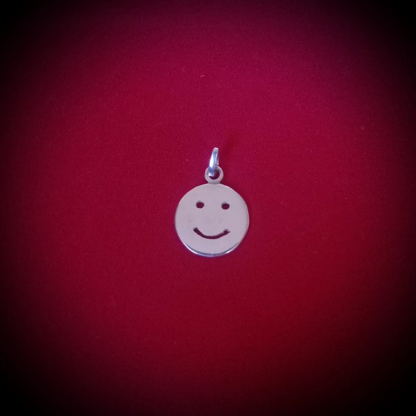 Dije de plata cara feliz